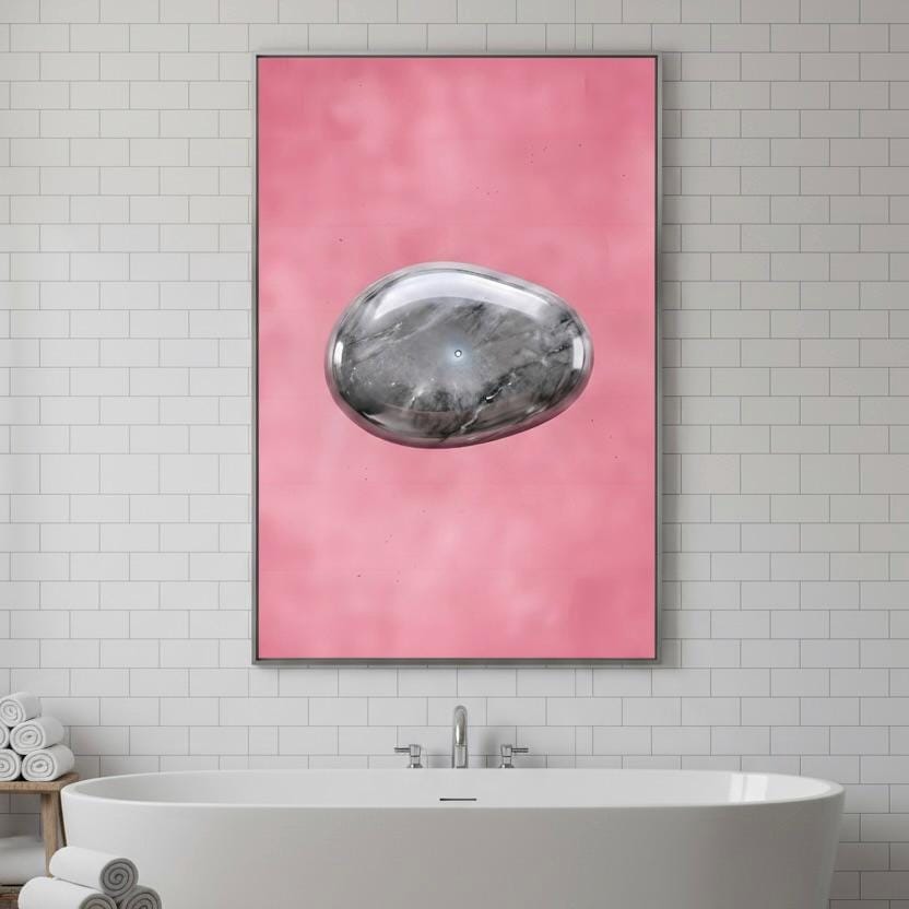 a large, abstract painting of a stone or rock in a pink background, hanging above a white bathtub in a bathroom setting.