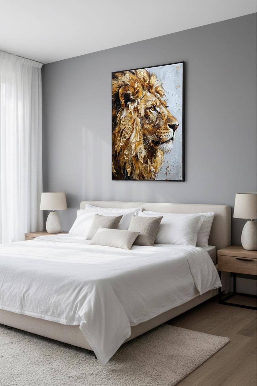 a bedroom with a large bed, white bedding, and a framed painting of a lion's head on the wall above it.