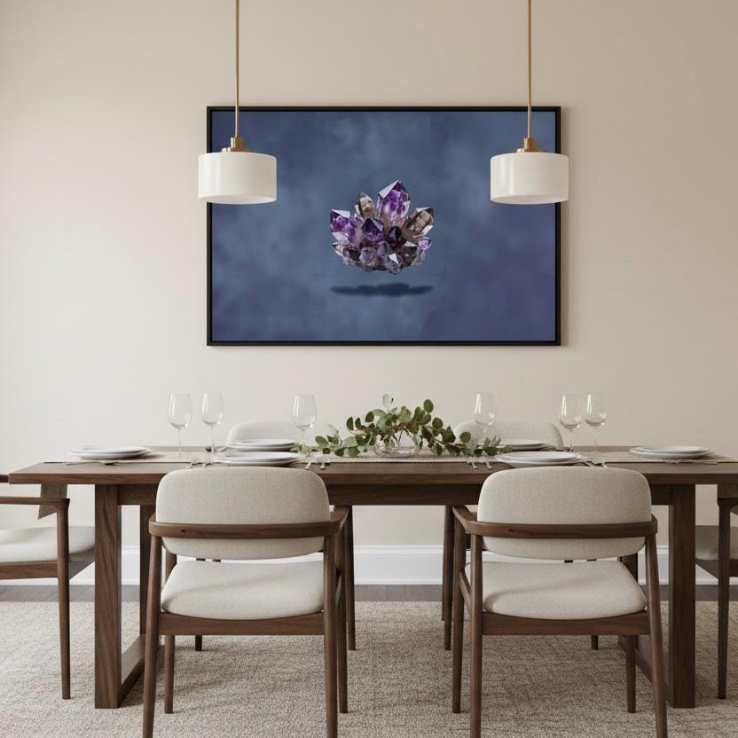 a dining room with a wooden table set for four, featuring white chairs and a centerpiece of purple crystals. Above the table, a framed artwork of a crystal formation is displayed on the wall.