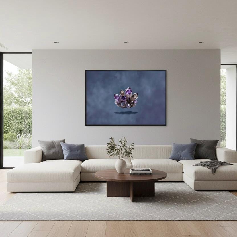 a modern living room with a large white sofa, a wooden coffee table, and a framed artwork of a purple flower on the wall.