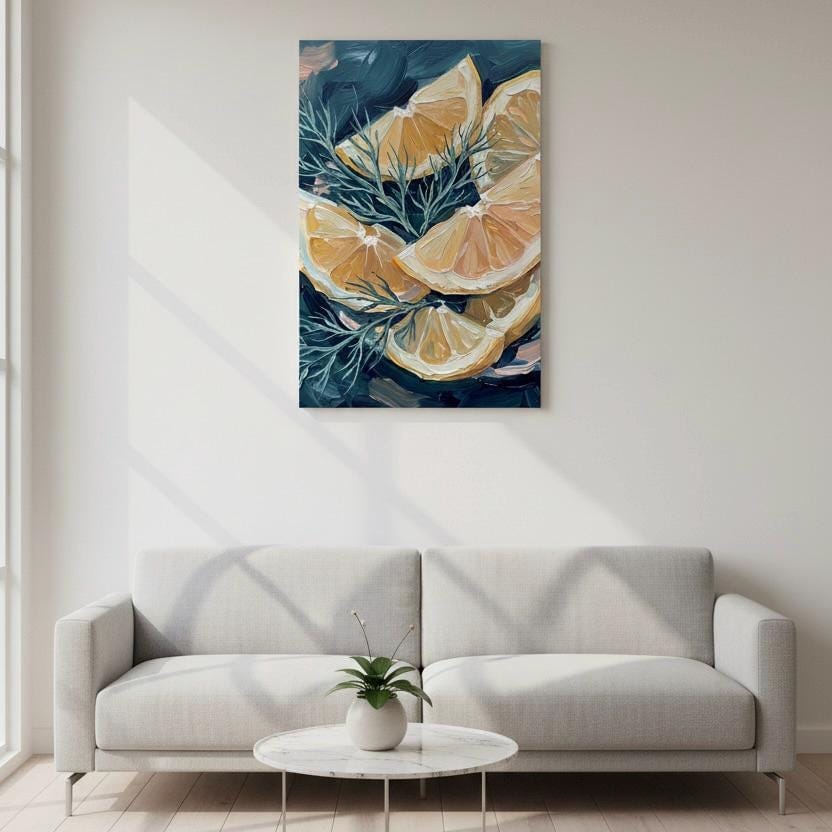 a living room with a gray sofa and a round coffee table. Above the sofa, there is a framed artwork depicting slices of oranges and greenery.