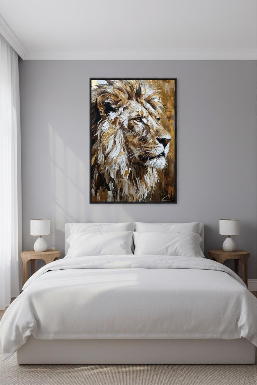 a large, framed painting of a lion's head hanging above a bed with white bedding in a bedroom setting.