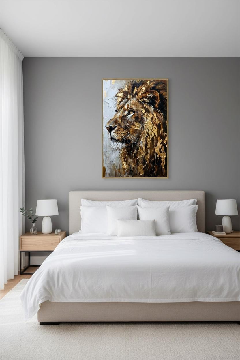 a bedroom with a large bed, white bedding, and a framed painting of a lion's head on the wall above it.