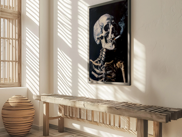 a wooden bench with a wooden sculpture on the floor next to it, and a framed image of a skeleton with a cigarette on the wall above the bench.