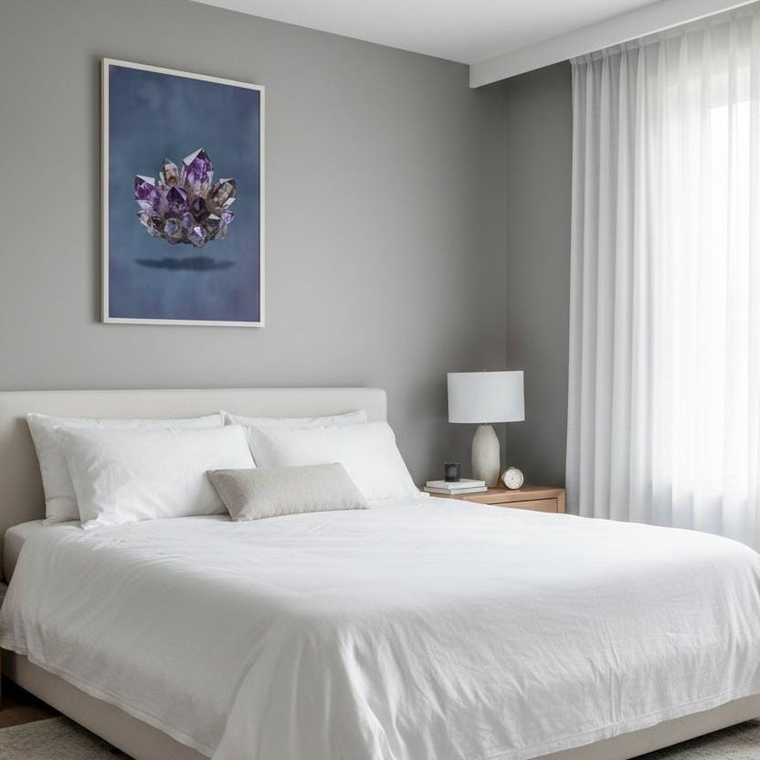 a serene and modern bedroom with a large bed, white bedding, and a framed artwork of purple crystals on the wall.