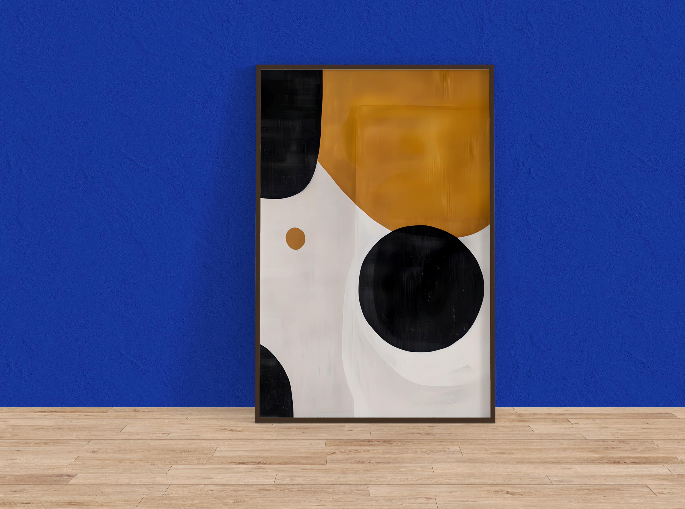 a framed abstract painting with a blue wall as the background.