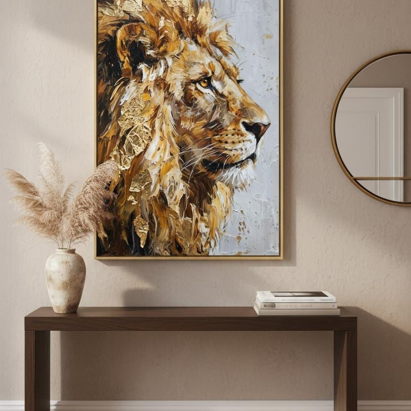 a large painting of a lion's head hanging on a wall above a wooden console table.
