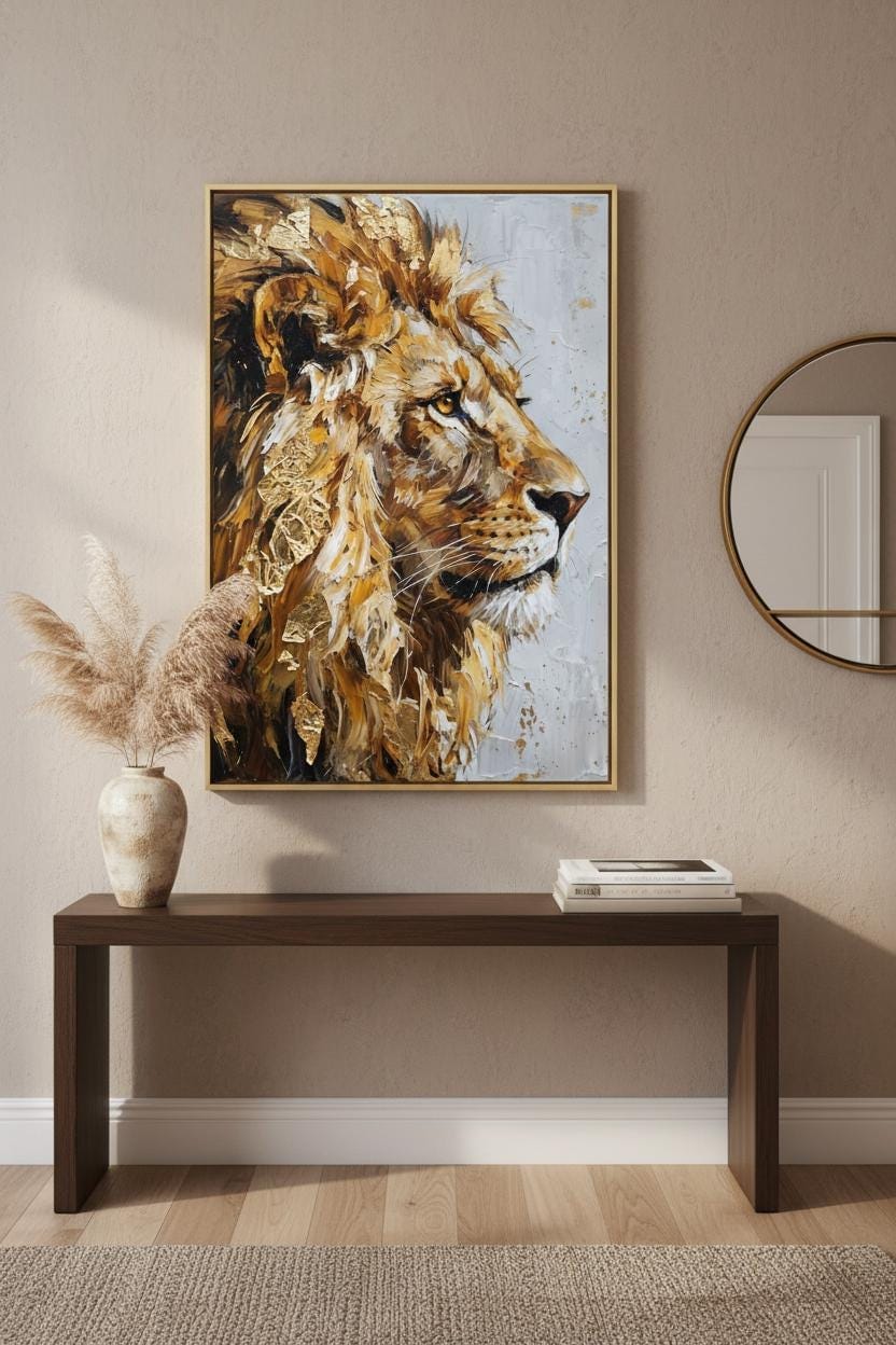 a large painting of a lion's head hanging on a wall above a wooden console table.
