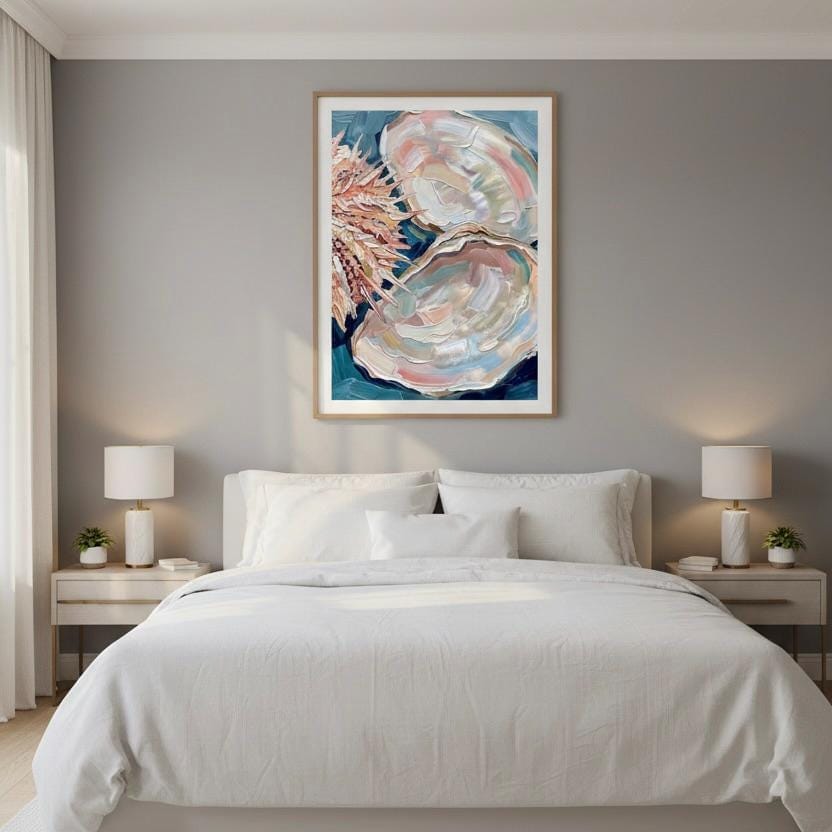 a serene bedroom scene with a large bed, white bedding, and a framed artwork featuring a shell and flowers hanging above it.
