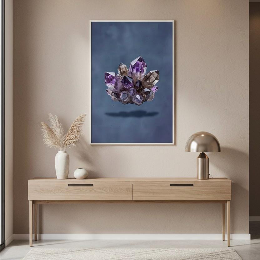 a wooden console table with a lamp and a framed photograph of a cluster of purple crystals hanging on the wall above it.