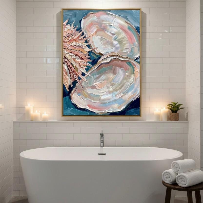 a bathroom with a large, colorful painting of an oyster shell hanging above a white freestanding bathtub. The painting is framed in gold and has a blue and pink color scheme. The bathroom has white tiled walls and a wooden stool near the bathtub.
