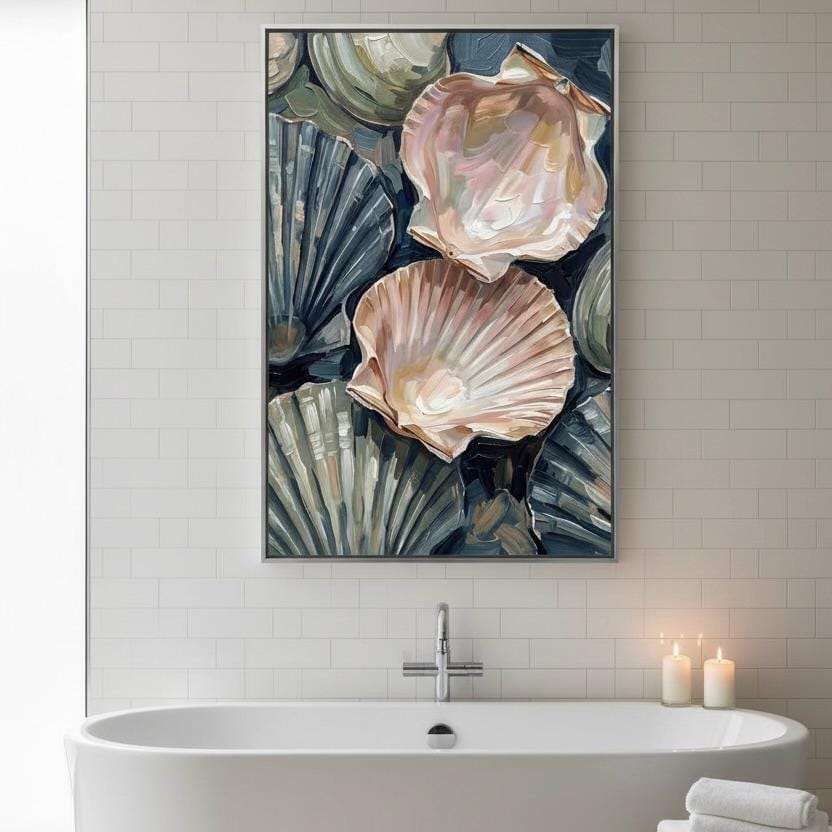 a large framed painting of seashells hanging above a white bathtub in a bathroom.